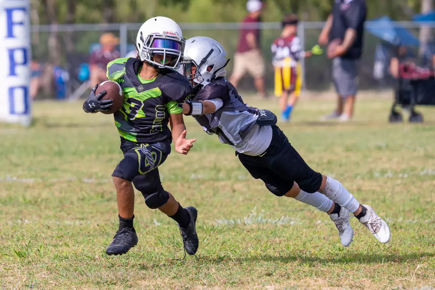 Football action photo captured using the Sigma 150-600mm lens, showcasing telephoto capabilities and sharp detail.