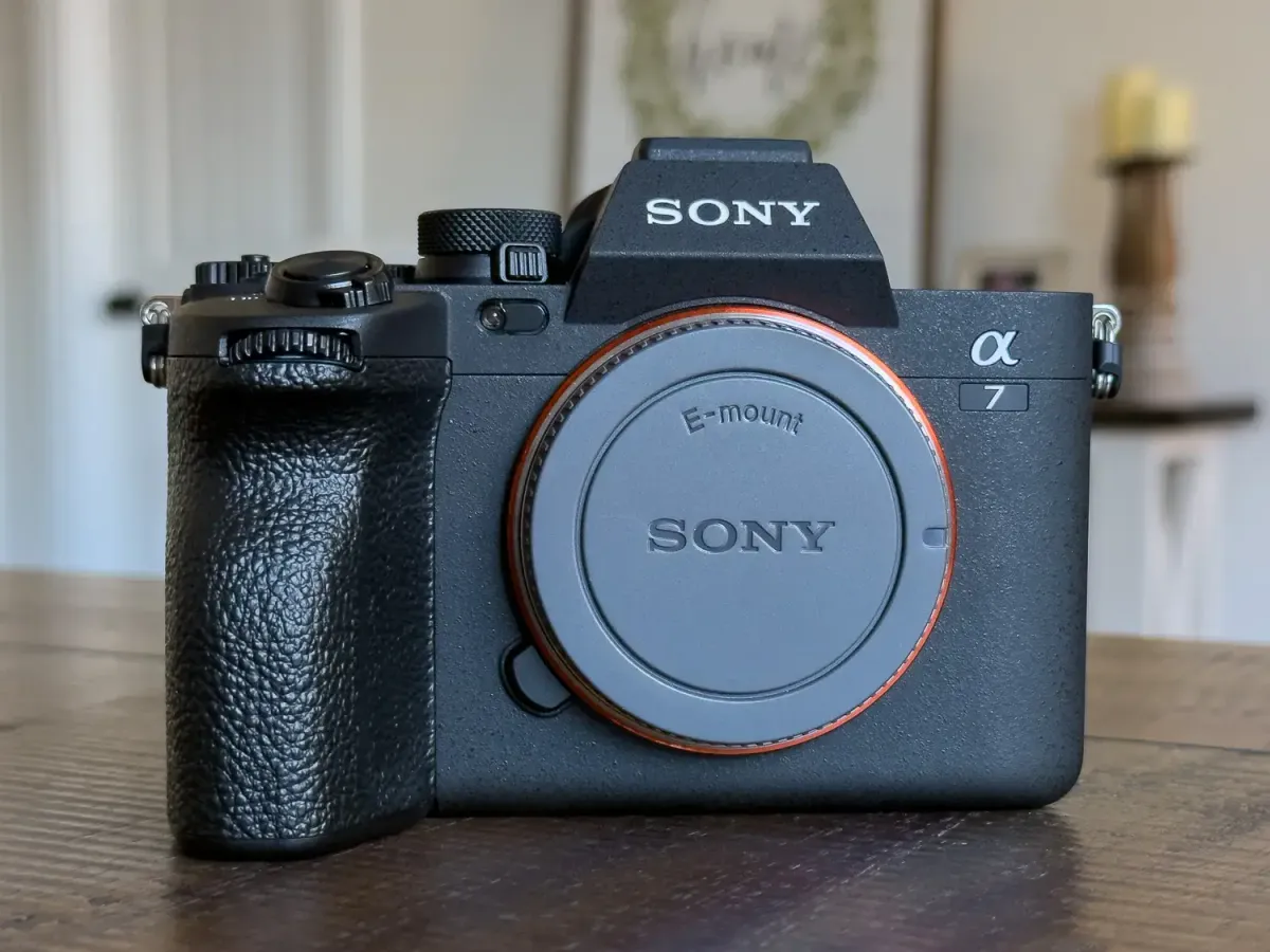 Front view of the Sony A7 IV camera body without a lens, showcasing its compact and durable design.